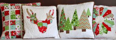 Christmas quilted cushion covers by Burlington Electric Quilters